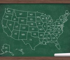 Map of the USA on a chalkboard with the state abbreviations
