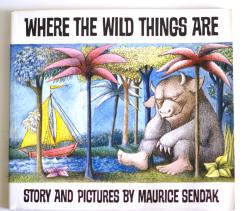 Illustrated book cover for Where the Wild Things Are showing a horned creature seated among palm trees near the sea, with a small sailboat in the background.