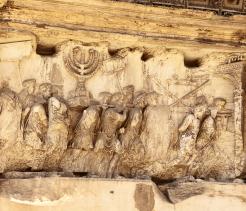 This wall relief on the Arch of Titus reveals Roman soldiers after the destruction of the Temple of Jerusalem in 70 A.D including the Temple Menorah, the Table of the Shewbread and silver trumpets.