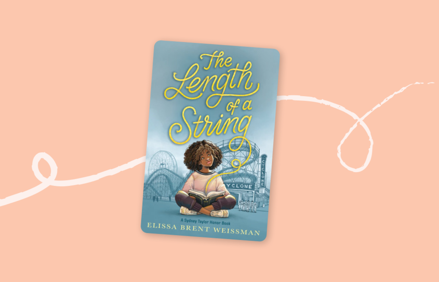 Cover of the children’s book The Length of a String, illustrated with a girl reading a book in front of an amusement park.