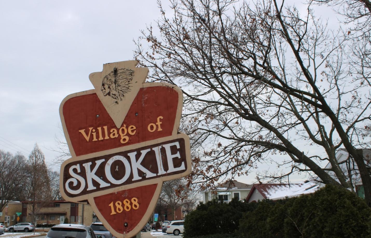 Skokie, Illinois, USA, Welcome to Skokie sign with Native American symbol in winter on an overcast day