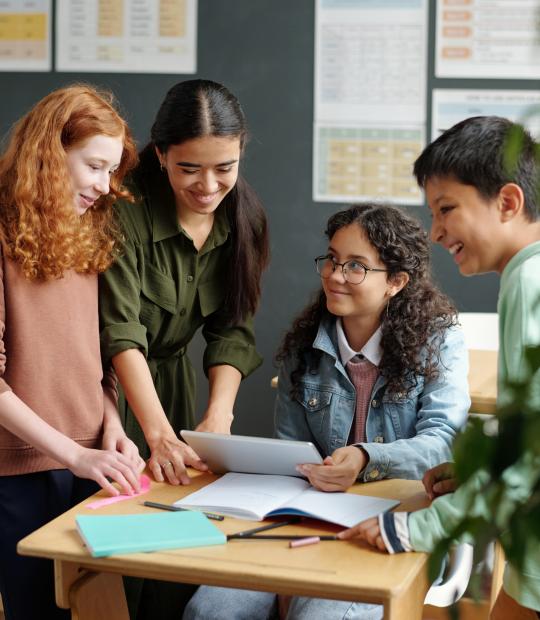 Students looking at a desk together
